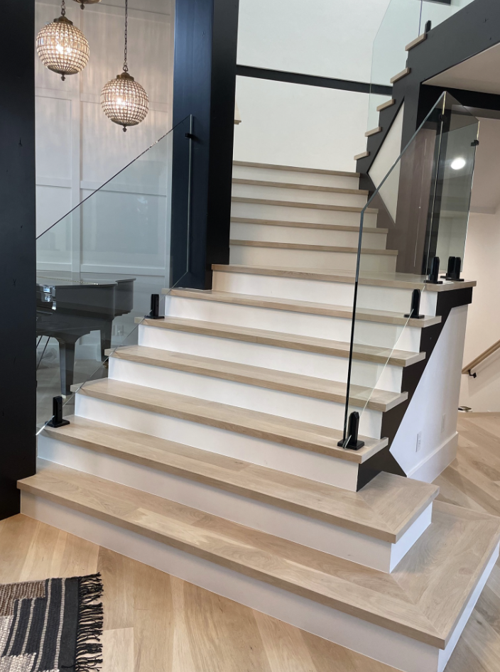 Custom glass staircase installation by Pine River Construction — Utah